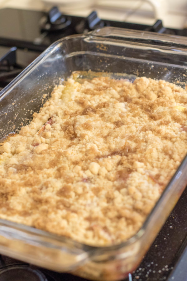 recipe2 (1 of 1) peach cobbler in a cooking tray hot out of the oven sitting on the counter.
