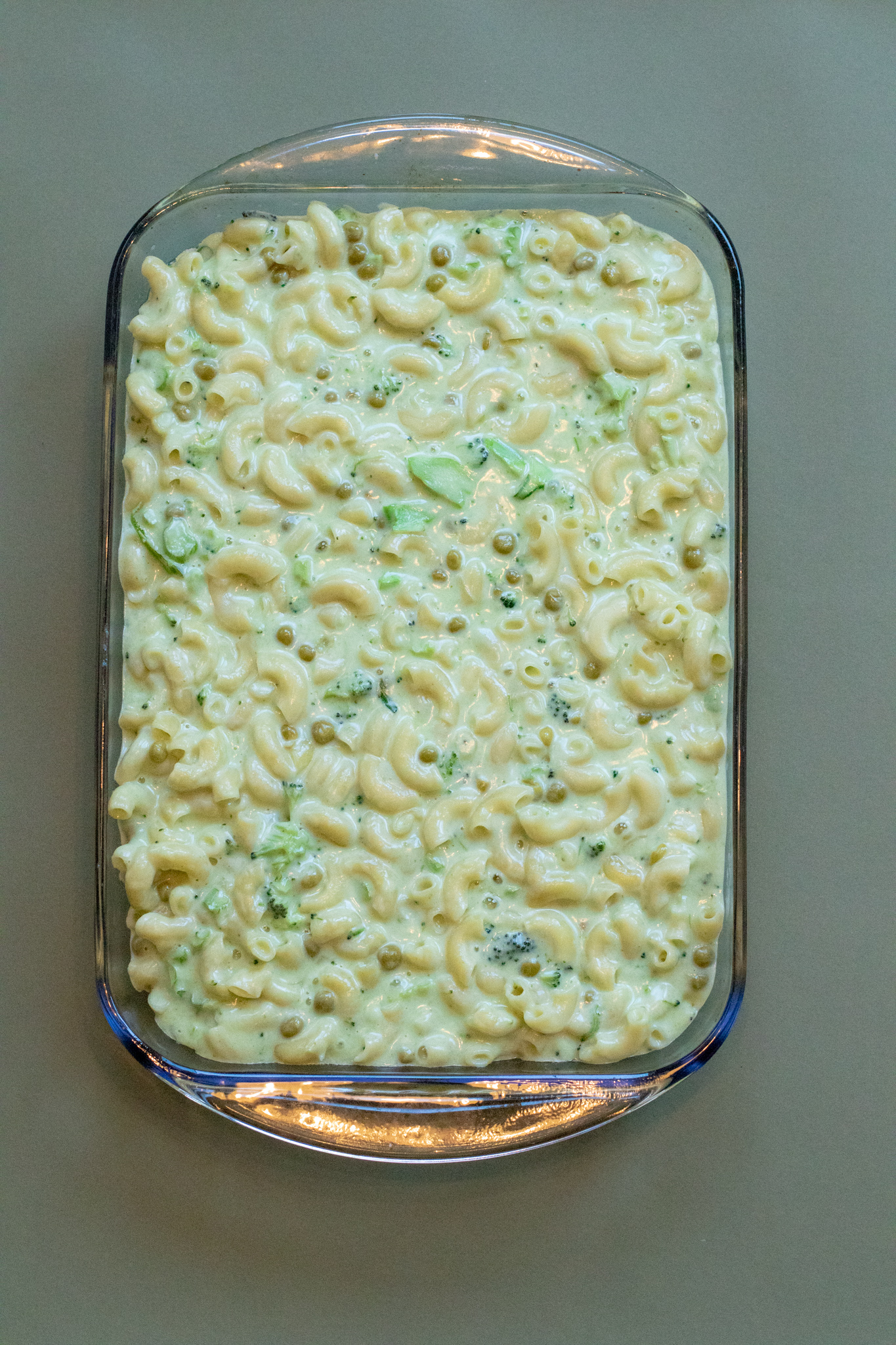 1Y8A7255 veggie macaroni and cheese in a baking dish with a green background.