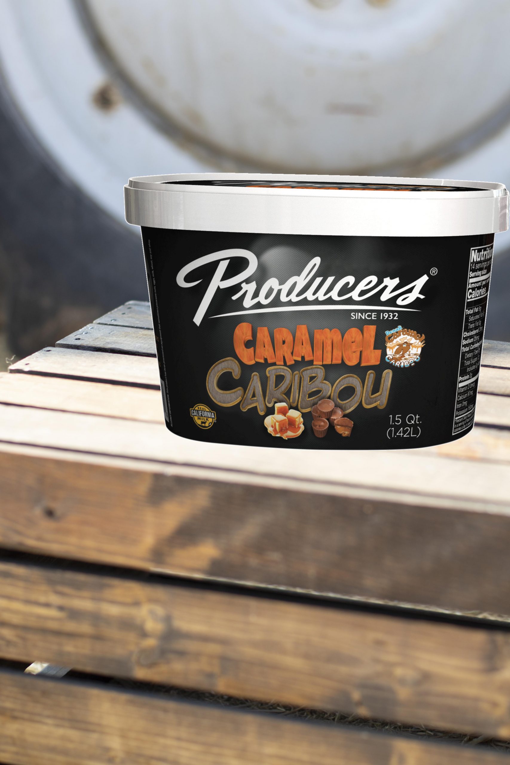 CaramelCaribou_Farm Caramel Caribou Producers Ice Cream sitting on wood in front of a tractor.